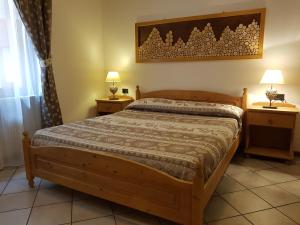 Postel nebo postele na pokoji v ubytování Casa Vacanze Dorigoni