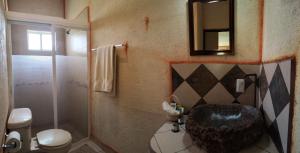a bathroom with a large sink and a shower at Hotel Casa del Arbol in Bernal +47 photos