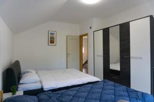 a small bedroom with a bed and a closet at Vila za odmor Svitavac in Trebinje +53 photos