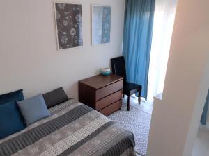 Llit o llits en una habitació de Nelli Apartman