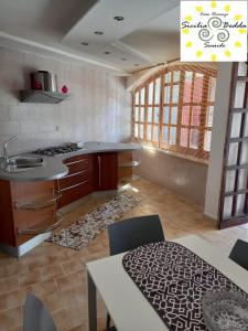a kitchen with a sink and a counter top at casa vacanze Sicilia Bedda Seaside in Santa Flavia