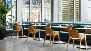 a row of tables and chairs in a restaurant at M Social Hotel Times Square New York in New York