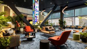 a living room filled with lots of furniture at M Social Hotel Times Square New York in New York