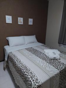 En eller flere senger på et rom på Apartamento Aconchegante em Miguel Pereira RJ!