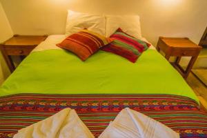 Postel nebo postele na pokoji v ubytování Tucan Hostel