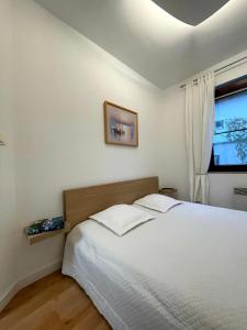 Ένα ή περισσότερα κρεβάτια σε δωμάτιο στο Apartament Jurata 30