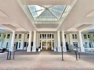 a large white building with columns and a glass ceiling at Grand Sandestin at Sandestin Resort by Tufan in Destin