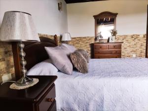 A bed or beds in a room at CASA DE LA CRUZ