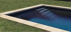 an overhead view of a swimming pool in the grass at Dimora Duchessina Suites de Charme in Minervino di Lecce