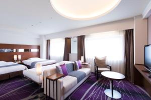Ein Bett oder Betten in einem Zimmer der Unterkunft Hakata Excel Hotel Tokyu