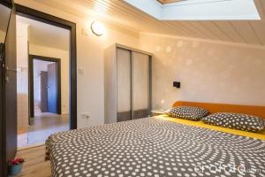 Postel nebo postele na pokoji v ubytování Apartments & Rooms Laganini