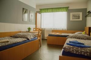 Posteľ alebo postele v izbe v ubytovaní Penzion 411