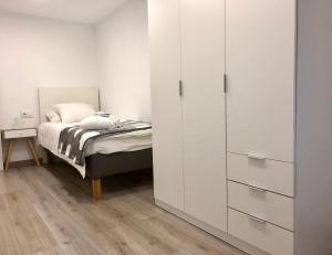 Postel nebo postele na pokoji v ubytování MonResidence Cavall Bernat + 3 fotografie