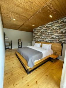 A bed or beds in a room at Vache Hotel