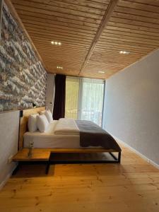 A bed or beds in a room at Vache Hotel