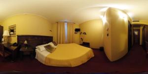 Ένα ή περισσότερα κρεβάτια σε δωμάτιο στο Hotel Damian Park Hotel Delle Magnolie