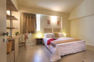 Postel nebo postele na pokoji v ubytování Palazzo Ruschioni Boutique Hotel
