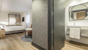 Postel nebo postele na pokoji v ubytování Hotel Ilunion San Mamés