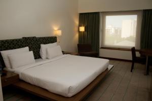 Rúm í herbergi á Hotel Parc Estique