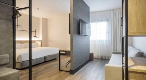 Postel nebo postele na pokoji v ubytování Hotel Ilunion San Mamés