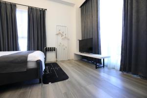 Postel nebo postele na pokoji v ubytování 微藍海岸海景電梯旅宿-包棟-東大門夜市
