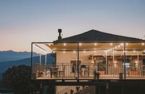 a house with a deck with lights on it at Il Perale in Caselle in Pittari