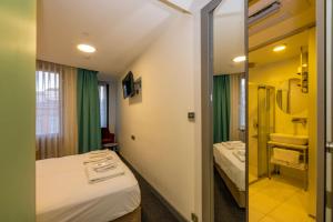 Postel nebo postele na pokoji v ubytování Taksim Hotel V Plus