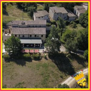 an aerial view of a house in a village at Locanda Cacio Re in Vallo di Nera