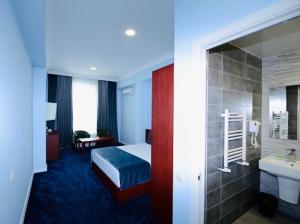 Voodi või voodid majutusasutuse Grand Fortune Hotel toas