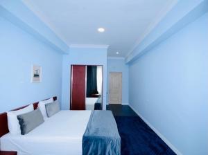 Voodi või voodid majutusasutuse Grand Fortune Hotel toas