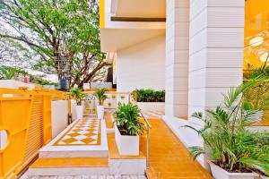 a courtyard with plants on a house at Bloom Hotel - Indiranagar in Bangalore