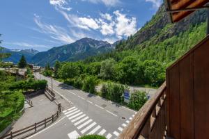 a view of a street with mountains in the background at Chalet Pontal 5 in Courmayeur