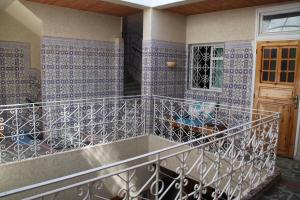 a balcony with blue tiled walls and a window at Riad Les Chtis D'Agadir in Agadir