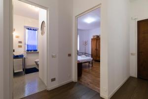 A bed or beds in a room at De Angeli - 2 Bedroom Apartment