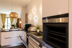 A kitchen or kitchenette at De Angeli - 2 Bedroom Apartment