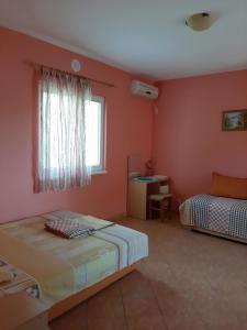 Ένα ή περισσότερα κρεβάτια σε δωμάτιο στο Apartments Kaprijan