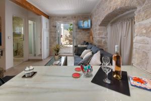 a living room with a couch and a table at Pavlos in Gaios