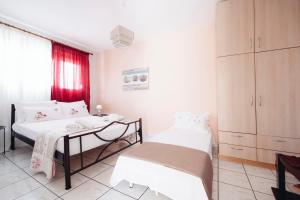 a hospital room with two beds and a table at Lydia's House in Kavála