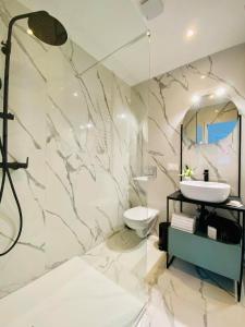 a bathroom with a sink and a toilet at Luxury TownHouse Baba in Dubrovnik