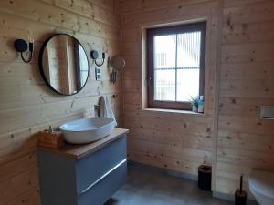 a bathroom with a sink and a mirror at Willa Kaszubiak in Ostrzyce +89 photos