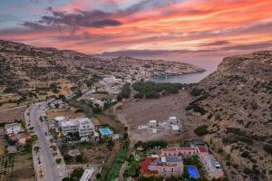 an aerial view of a town on a mountain at Calypso Hotel in Matala
