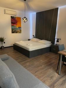 a bedroom with a large bed in a room at Apartments Villa Jelena in Vodice