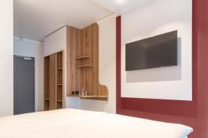 Postel nebo postele na pokoji v ubytování Hotel Wettiner Hof