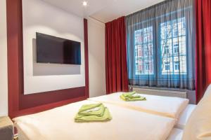 Postel nebo postele na pokoji v ubytování Hotel Wettiner Hof
