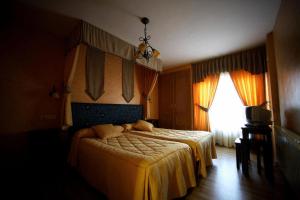 Postel nebo postele na pokoji v ubytování Posada Real La Yensula + 11 fotografií