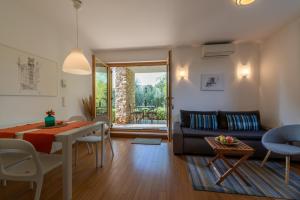 a living room with a couch and a table at Casa Bamboo in Banjole
