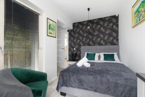 A bed or beds in a room at Stara Polana Apartamenty & Spa Zakopane by Renters Prestige
