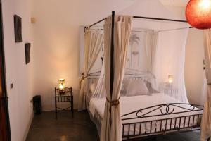 Łóżko lub łóżka w pokoju w obiekcie Magic House Bonaire