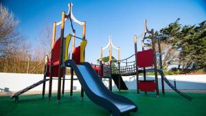 a playground with a slide and a slideintend at NB12 Entire Caravan - Newquay in Porth
