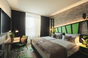 Postel nebo postele na pokoji v ubytování Holiday Inn - the niu, Hop Forchheim by IHG + 18 fotografií
